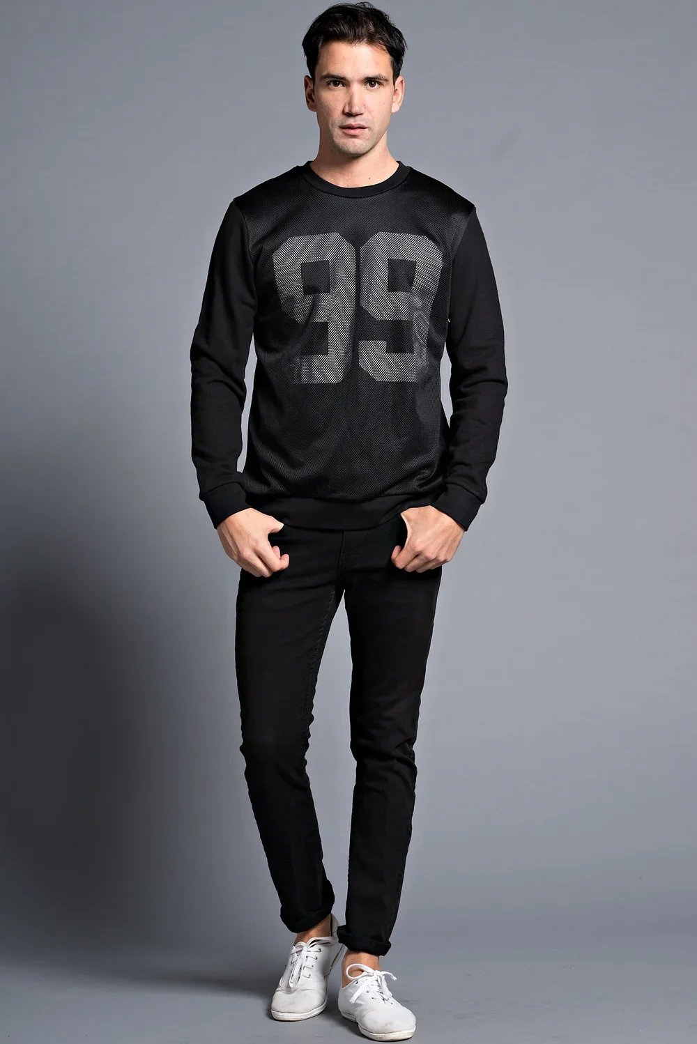 Man wearing a black sweatshirt with large gray number 99 — Urban Nation graphic sweatshirt