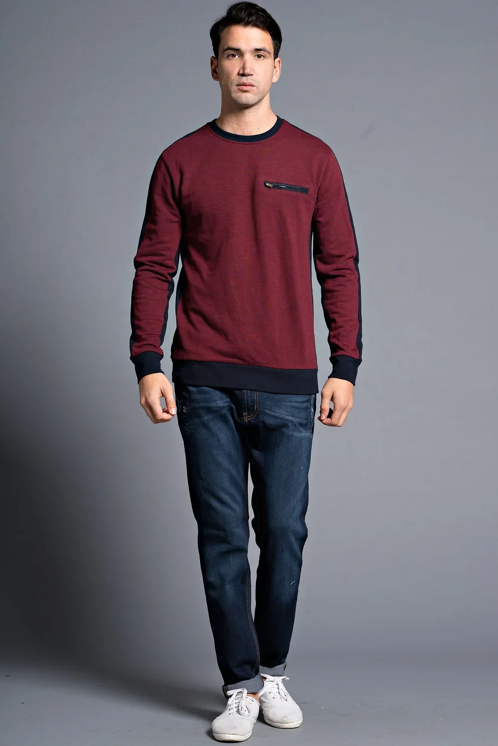 Man wearing a red and black long-sleeve sweatshirt with a zippered chest pocket — Urban Nation menswear